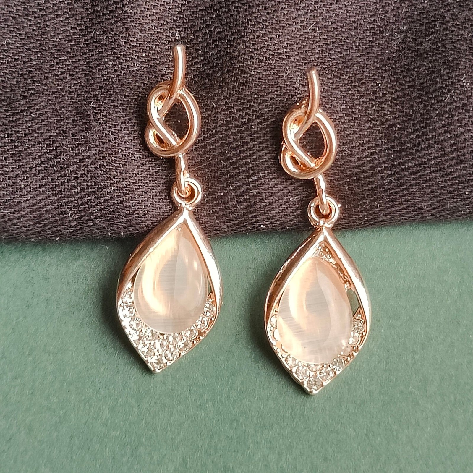Elegant Rose Gold Knot Drop Earrings with Crystal Halo - Image 2